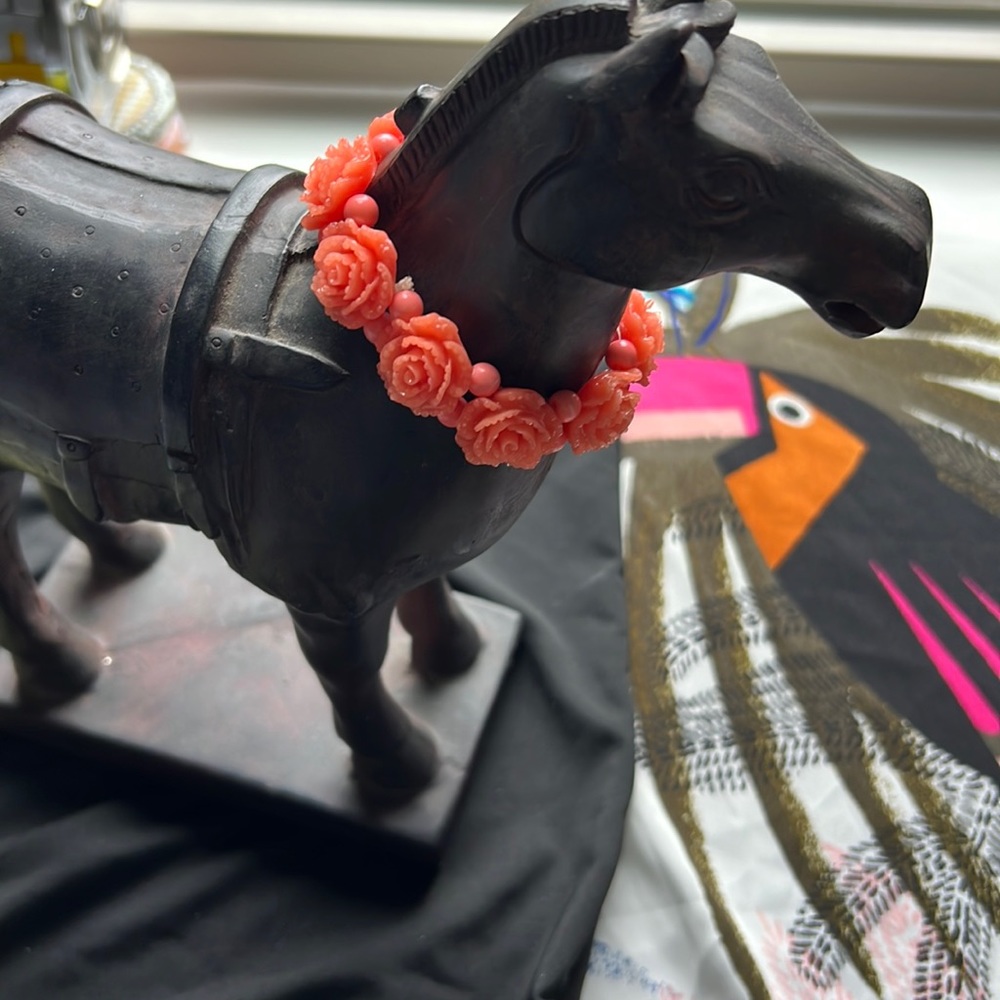 Orange flowers and pink beads. Women’s fashion bracelet.